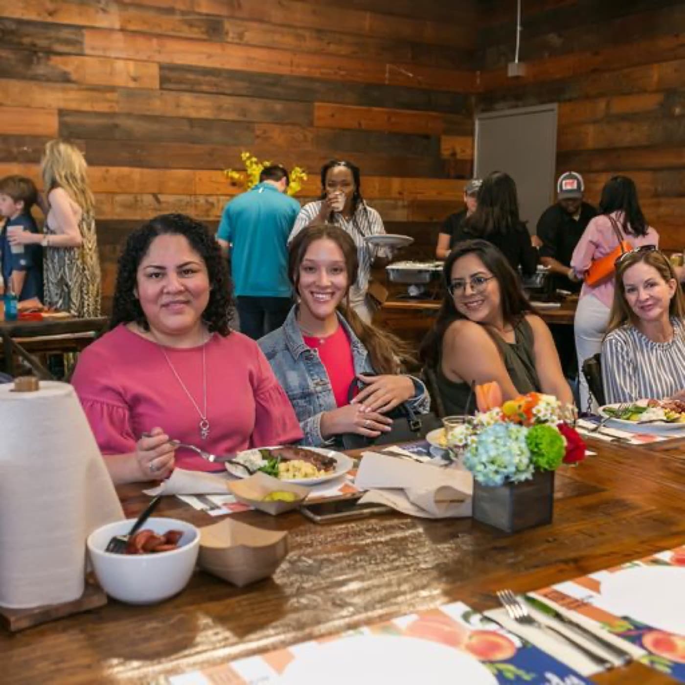 UnionMain Homes coworkers sharing a meal together at the company BBQ