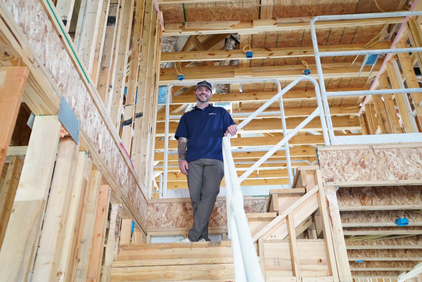 UnionMain Homes construction team member walking through a home in progress